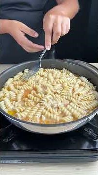 Skillet fusilli pie with cheese and tomato