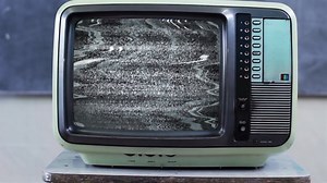 Retro Television Set turning On Green Screen with Color Bars in a School, Zoom Into Green Screen. Close Up. 4K Resolution.