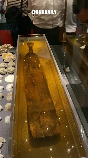 Ancient Chinese Wooden Paddle Displayed at Beijing Museum