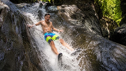 Slip and slide waterfall drops 35 feet into water
