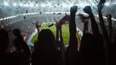 4k video of a group of cheering fans watch a sport championship on...