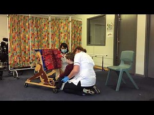 Transferring a child into a Prone Standing Frame
