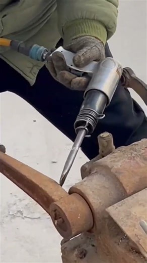 Handheld #pneumatic or electric impact tool of jack hammer or impact driver work on heavy machinery