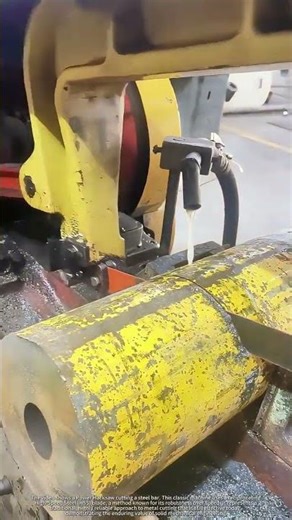 Classic Power Hacksaw Cutting a Steel Round Bar