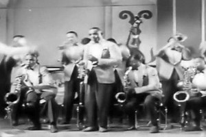 1940s: Jazz saxophone artist Erskine Hawkins and his orchestra play in the 1942 soundie.