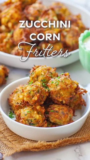 Crispy, fluffy, cheesy zucchini corn fritters with a creamy, garlicky dipping sauce! These are so addictive! Get the recipe: https://tatyanaseverydayfood.com/easy-zucchini-corn-fritters/ | Tatyana's Everyday Food