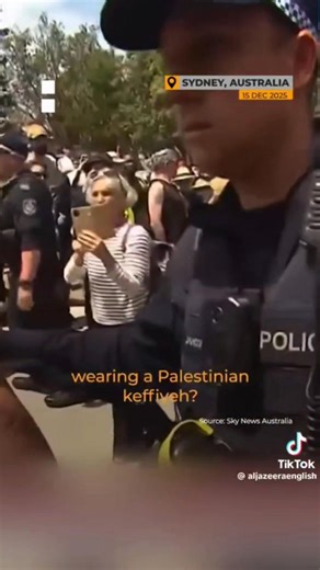A Jewish woman was threatened with arrest and removed from Bondi Beach memorial for wearing a keffiyeh, yet flags of the genocidal Zionist regime were welcome. Michelle Berkon, the Jewish activist said the tragedy was politicised, with Israeli flags turning a space for grief into a political statement. She speaks very calmly and strongly here. She reiterated ALL JEWS have the right to mourn. A jew who stands against genocide is not anti-semitic. They are pro-humanity. | Saima Jamal