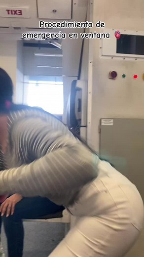 Emergency Exit Procedure Demonstration in Airplane Cabin