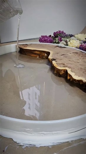 Combining natural wood with epoxy resin can create unique furniture pieces. This guide covers the creative process and key techniques for crafting resin tables, including material choices and finishing methods. | The Daily Compass