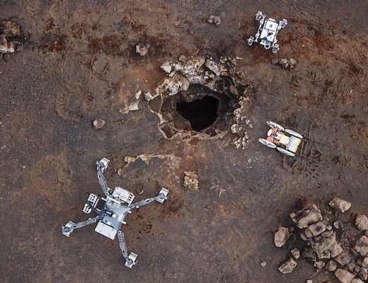 Cooperative robotic exploration of a planetary skylight surface and lava cave