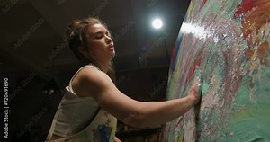 Beginning female artist draw abstract picture with hand and finger. Concept of modern art, hobby painting, self-expression, creation sensual created masterpiece, craft with inspiration