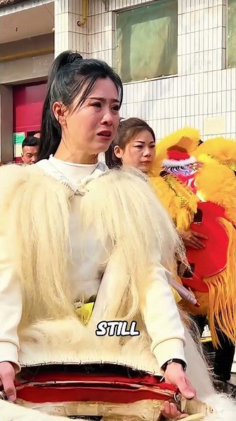 The woman put on a lion costume because she was afraid