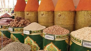 Colourful containers filled with herbs and spices on Morocco food market