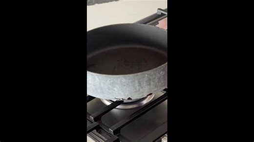 Stick a candle into a frying pan...