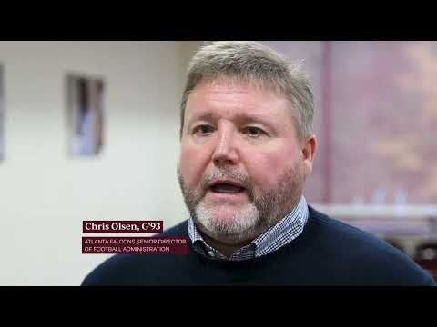 Chris Olsen, G'93, of the Atlanta Falcons visits with Springfield College Students