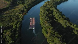 grain barge going up the tiete-parana waterway, on the tiete river