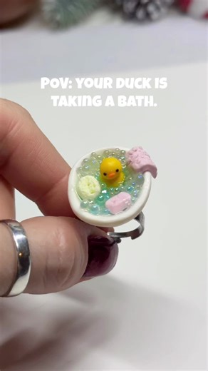 Duck in a bathtub ring - handmade polymer clay ring. Ring #3 from this batch. First there was a frog in a bathtub, then a duck in a frozen lake… and now this duck saw the frog bathing and decided she’s next. Would you wear it? #polymerclay #polymerclayart #handmadejewelry #miniatures
