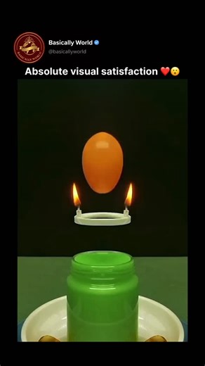 Basically World on Instagram: "Absolute visual satisfaction 👀 A perfectly balanced wax sphere melts between two identical candles, dripping downward in near-perfect symmetry. As both flames heat evenly, the wax flows in mirrored streams, slowly forming smooth, sculptural shapes that feel almost unreal. The slow motion, clean symmetry, and soft color contrast make the entire sequence oddly calming and hypnotic — one of those visuals you can’t stop watching."