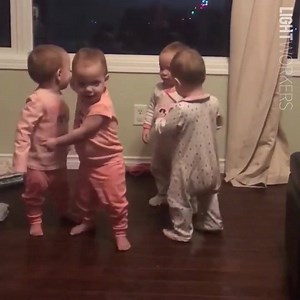 Babies hugging each other | theDove