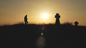 Download Silhouette of a man at sunset for free