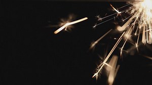 Pyrotechnic sparkler on a dark background - Free Stock Video