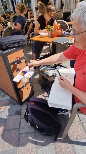 Sabine Dreher was using our Sketcher kit in Poznań today, and it was so cool to see her in action. She's making excellent use of the universal clamp and dock combo, which lets her position the box just right using nearby street furniture. Come and see us today. We'll again be at the Market Square in Poznan. | Lintner Art Gear
