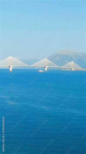 Vertical video. Patras, Greece. The Rio-Antirrio Bridge. Officially the Charilaos Trikoupis Bridge. Bridge over the Gulf of Corinth (Strait of Rion and Andirion). Drone footage