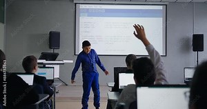 Smart Schoolboy Speaking In Front Classmates In Classroom, Presenting Program Code In Class