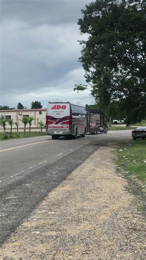 ADO bus being towed with Tractor Truck