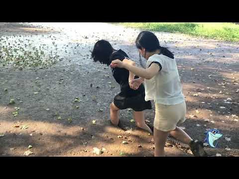 Two girl run in mud with dress