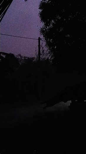 "Janlar baire bristi ... mon-ta kothao jeno hariye jachhe. ⛈️✨ #MonsoonVibes"