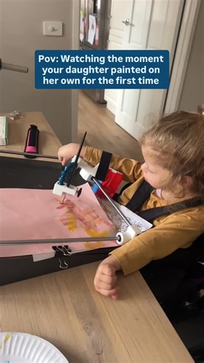 ImaginAble Solutions | Guided Hands on Instagram: "POV: watching your child create independently for the first time. 💙 Nothing describes the feeling of seeing your 3-year-old daughter paint on her own. Willow has cerebral palsy, and with the help of Guided Hands®, she was able to create this painting all by herself. This moment is about more than art. It’s about confidence, independence, and discovering what’s possible. Want to learn how Guided Hands® can support moments like this? Comment WEBI