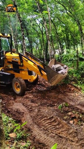 Moving rocks with a JCB 3dx Backhoe Loader.