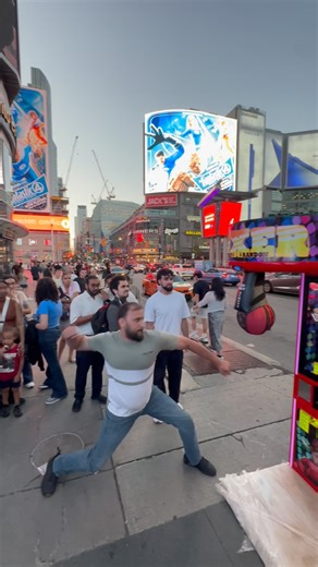 Toronto Papi on Instagram: "Strongman Testing the punching machine in downtown Toronto. #toronto #Canada"