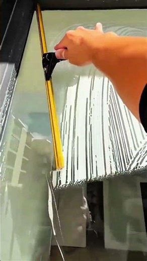 Ruler leans boxes align hand steadies measure marks pattern echoes