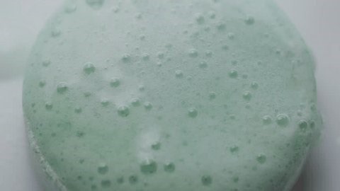 clip-3805864535-water-reacting-effervescent-tablet-creating-fizzing-effect