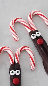 Candy Cane Reindeer! Dip candy canes in melted chocolate (dove chocolates are the easiest!), and add candy eyes with an M&M nose... ADORABLE! | Smart School House