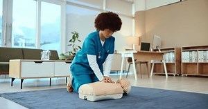 Woman, cpr dummy and nurse training, medical student and learning resuscitation in hospital. Mannequin, first aid and chest compression for heart attack at clinic, doctor and emergency procedure