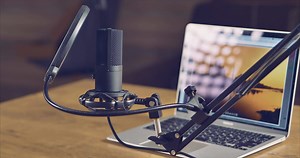 Download Home studio for an audio podcast host. Studio microphone and laptop on the table for free