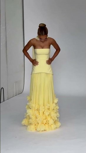 Radiate sunny elegance in this strapless yellow dress with blooming floral trim.