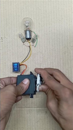 Powering 3- tungsten filament bulb with gear motor power generating system