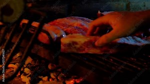 Typical and authentic Argentinian Barbecue Or Asado. Burning Wood In The Grill And Red Hot Coals