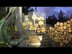 John Deere 1010G unloading sawlogs