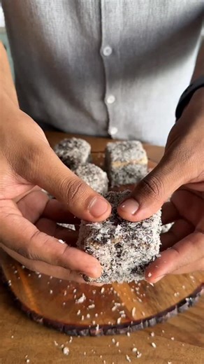 Best ever Chocolate Lamingtons recipe 😍 (Recipe recreations from the world ep. 21) . A few months back I curated this insane dessert table for the @australia event in mumbai! Out of all the dessert the lamingtons were probably the most Aussie thing ever 🥰, so I thought of sharing my recipe with y’all for the same. . Just make sure you’re following me and comment the word “Lamington” to get the recipe in your DMs 😍 . (Dessert, table, recipes, tea cake, cake, bakery, baking, viral, trending) | 