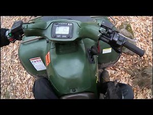 Riding Kawasaki Prairie 650 in the Woods (Wheelieing & Jumping)