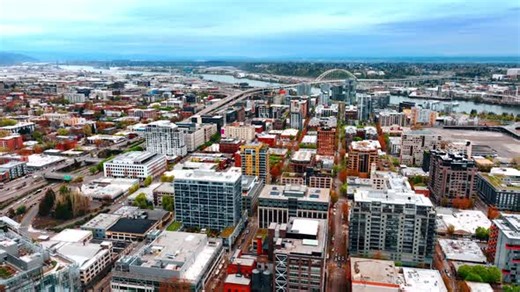 Multi-storied blocks of flats in the panorama of American city. Drone footage above Portland, Oregon