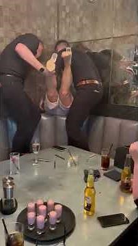 Bottoms Up: Restaurant Staff Help Woman Wedged Behind Couch at Brunch