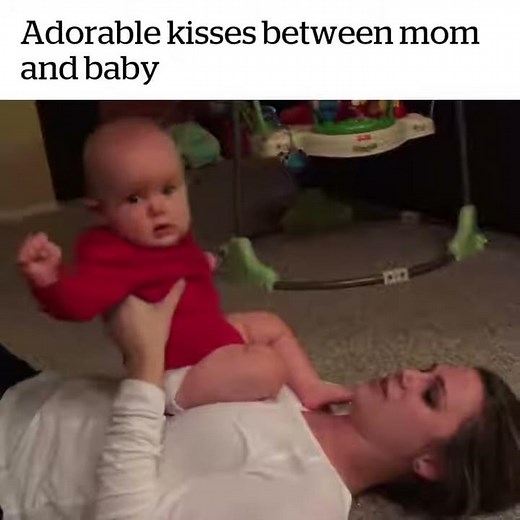 Adorable kisses between mom and baby