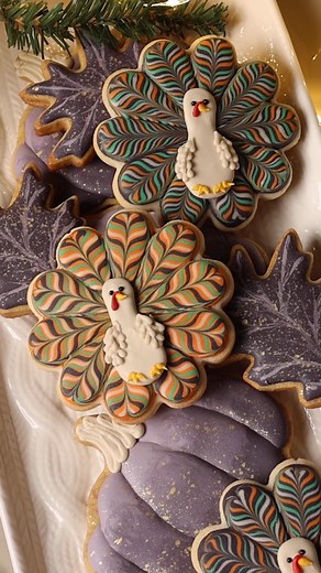 One of my favorite things about these turkey cookies is that they’re made using a flower cookie cutter. I love finding new ways to use cookie cutters that I already own! I used the royal icing transfer method to make the bodies of the turkeys instead of piping them directly onto the cookie, which gives the turkey cookie more dimension. This method also allows me to get a head start on my cookies since the royal icing transfers are shelf stable at room temperature once they’re dry. The template, 