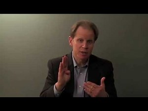 Dr Daniel Siegel presenting a Hand Model of the Brain